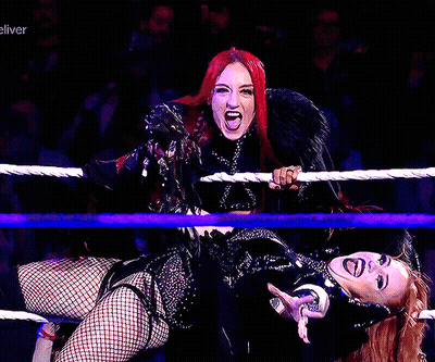 Two Women Wrestling In Ring Saying Eliver GIF