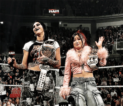 Two Women Wrestling In Ring Saying Raw GIF