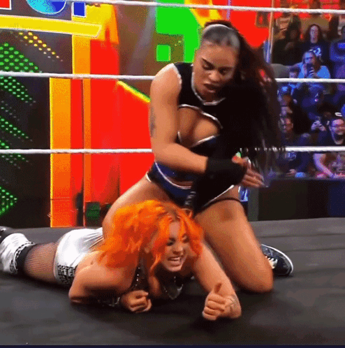 Two Women Wrestling In Ring With Crowd GIF