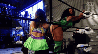 Two Women Wrestling In Ring With Fite Sign GIF