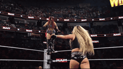 Two Women Wrestling In Ring With RAW On Wall GIF
