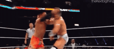 Two Wrestlers Are Fighting In A Ring And The Next Big Thing Is On The Bottom GIF
