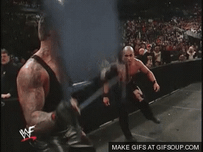 Two Wrestlers Are Fighting In A Ring With A Watermark That Says Gifsoup.com On The Bottom GIF