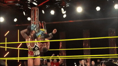 Two Wrestlers Are In A Ring And One Of Them Is Wearing A Shirt That Says ' A ' On It GIF
