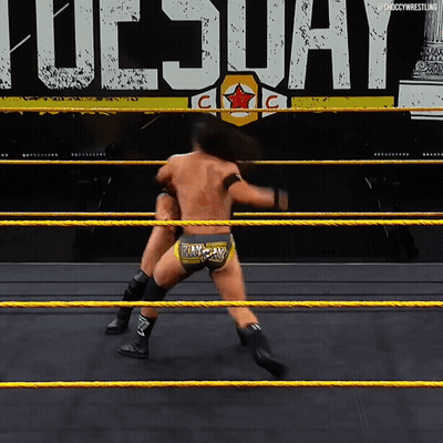 Two Wrestlers Are In A Ring With The Word Tuesday In The Background GIF