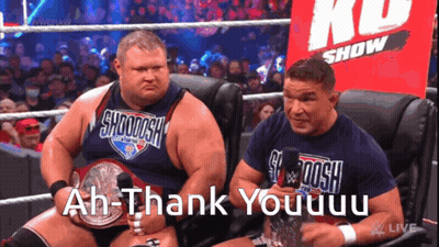 Two Wrestlers Are Sitting In Front Of A Crowd And One Of Them Says Ah-Thank Youuuu GIF