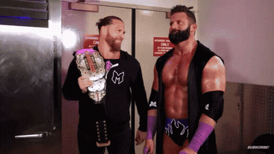 Two Wrestlers Are Standing In Front Of A Door That Says Authorized Only On It GIF