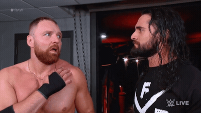Two Wrestlers Are Standing Next To Each Other And One Has A Shirt That Says F On It GIF