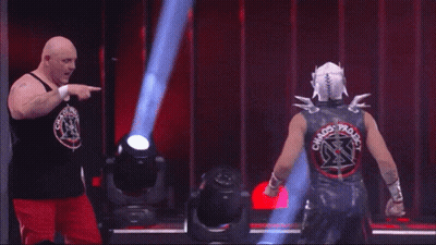 Two Wrestlers Are Standing Next To Each Other And One Has The Name Serpentico On The Screen GIF