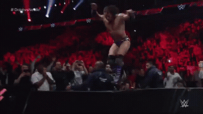 Two Wrestlers Are Wrestling In A Ring With A W Netwo Banner In The Background GIF