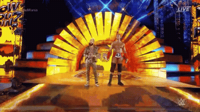 Two Wrestlers Fighting In Ring With Referee GIF