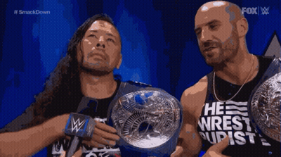 Two Wrestlers Holding Championship Belts Fox GIF