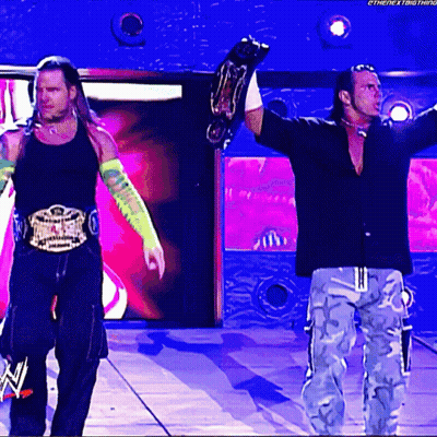 Two Wrestlers Holding Championship Belts Next Thing GIF