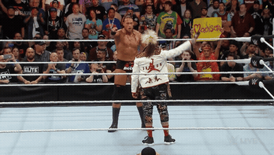 Two Wrestlers In A Ring With A Sign That Says Madison On It GIF