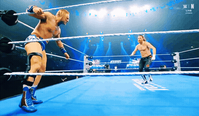 Two Wrestlers In A Ring With N On The Bottom GIF