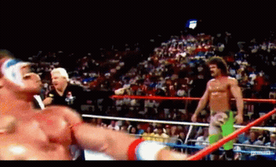 Two Wrestlers In A Ring With Referee GIF