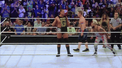 Two Wrestlers In A Ring With The Word Live On The Bottom GIF