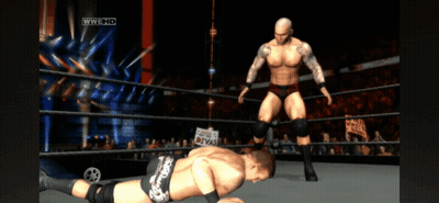Two Wrestlers In A Wrestling Ring With A Sign That Says Divas In The Background GIF