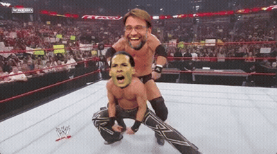 Two Wrestlers In A Wrestling Ring With A Wwe Logo On The Bottom GIF