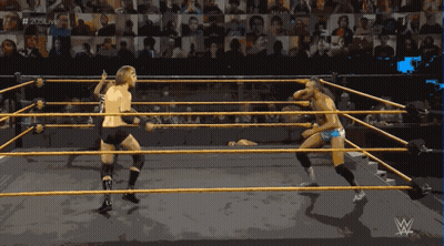 Two Wrestlers In A Wrestling Ring With The Hashtag # 205Live In The Background GIF