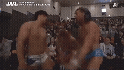 Two Wrestlers In Front Of Crowd Saying Dot GIF