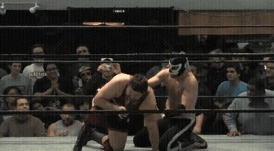 Two Wrestlers In Ring, One Masked With Killer Shirt GIF