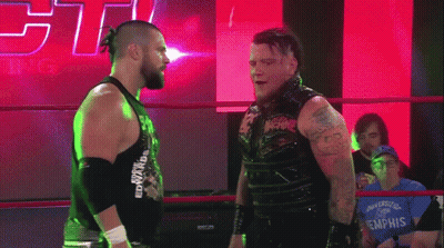 Two Wrestlers In Ring One Wearing Edward Tank Top GIF