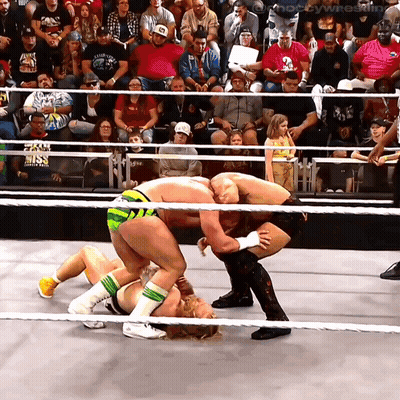 Two Wrestlers In Ring One Wearing Fox Shirt GIF