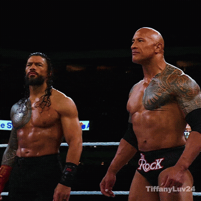 Two Wrestlers In Ring One Wearing Rock Shorts GIF