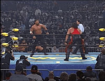 Two Wrestlers In Ring One Wearing Squat Shirt GIF