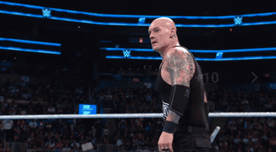 Two Wrestlers In Ring With Make A Whoop Dat Sign GIF