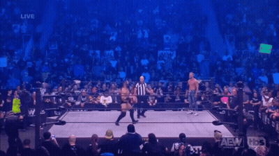 Two Wrestlers In Ring With Referee GIF