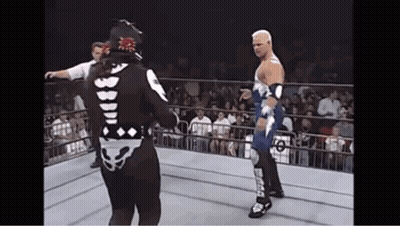 Two Wrestlers In Ring With Smack On Leg GIF
