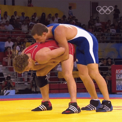 Two Wrestlers On Mat Saying Ask USA Hunt GIF