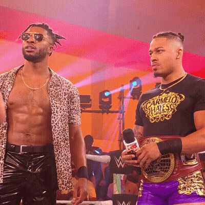 Two Wrestlers One In Carmelo Hayes T-Shirt GIF