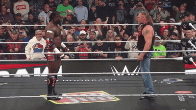 Two Wrestlers One In Punk Shirt GIF