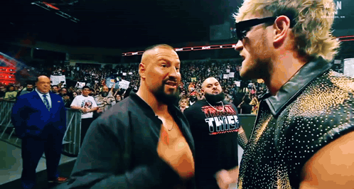 Two Wrestlers One Wearing Thunder Thunder Shirt