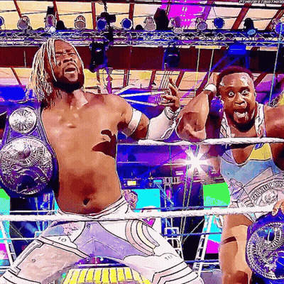 Two Wrestlers With Championship Belts GIF