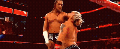 Two Wrestlers Wrestling In Ring With Crowd GIF