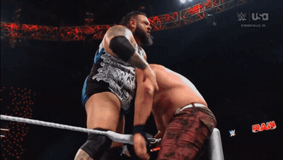 Two Wrestlers Wrestling In Ring With W GIF