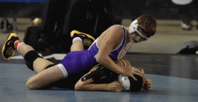 Two Wrestlers Wrestling One Laying On Other's Back GIF