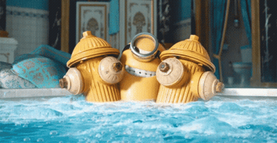 Two Yellow Fire Hydrants Are In A Bathtub GIF
