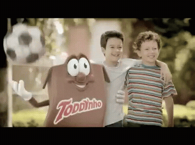 Two Young Boys Next To Toddynho Candy GIF