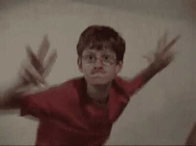 Two Young Boys Standing Next To Each Other GIF