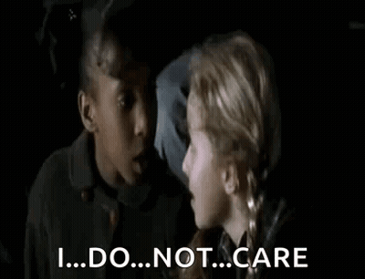 Two Young Girls Are Talking To Each Other In A Dark Room And One Girl Is Saying `` I ... Do ... Not ... Care '' . GIF