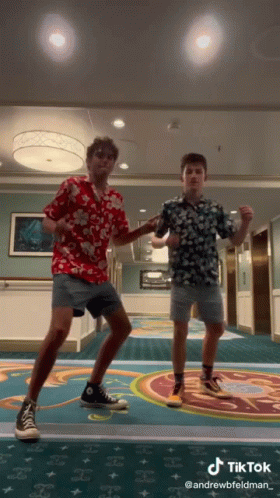 Two Young Men Are Dancing In A Hallway With A Tiktok Watermark On The Bottom GIF