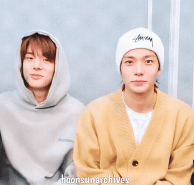 two young men are holding hands with the words hoonsunarchives written below them