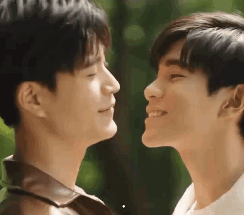 Two Men With Eyes Closed Looking At Each Other GIF