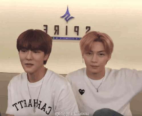 Two Young Men Are Standing Next To Each Other And One Has A T-Shirt That Says Tthahaj On It GIF