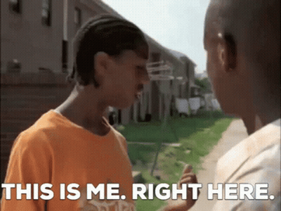 Two Young Men Are Standing Next To Each Other And One Of Them Is Saying This Is Me . Right Here . GIF